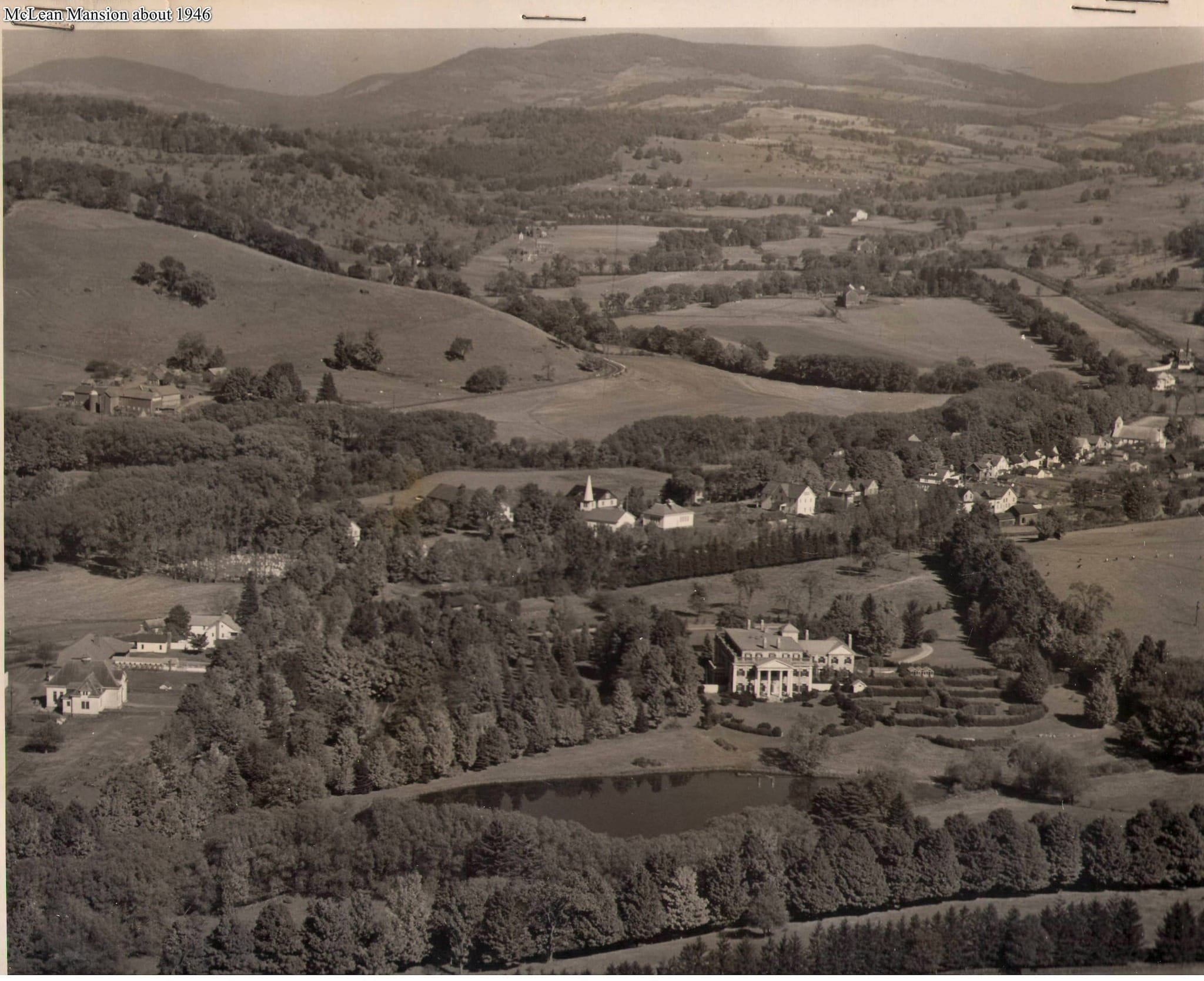 Aerial photograph of Ashridge Estate (then the McLean estate) and South Kortright, c. 1946 — mansion, lake, formal gardens, and Catskill landscape.