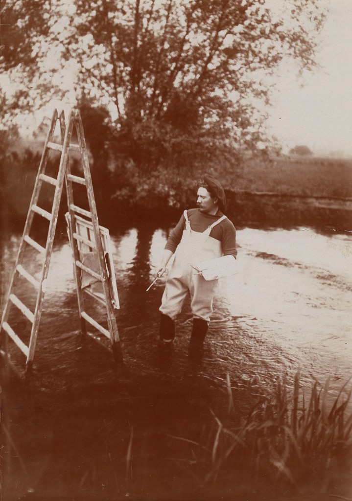 Louis Aston Knight painting en plein air — standing in a river at his easel, palette in hand, beret and waders