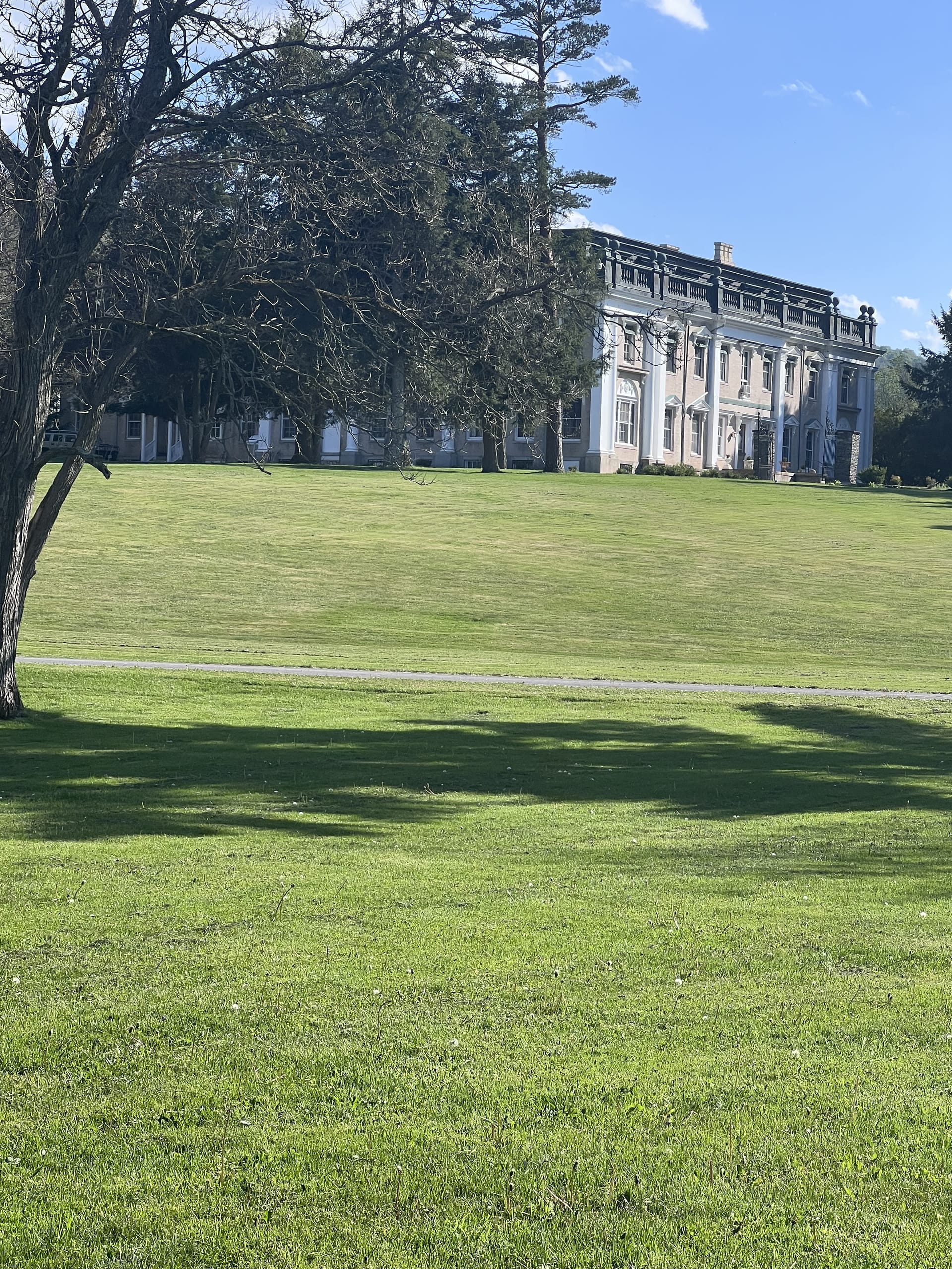 Ashridge mansion — side view of the full columned facade across the lawn, South Kortright, New York