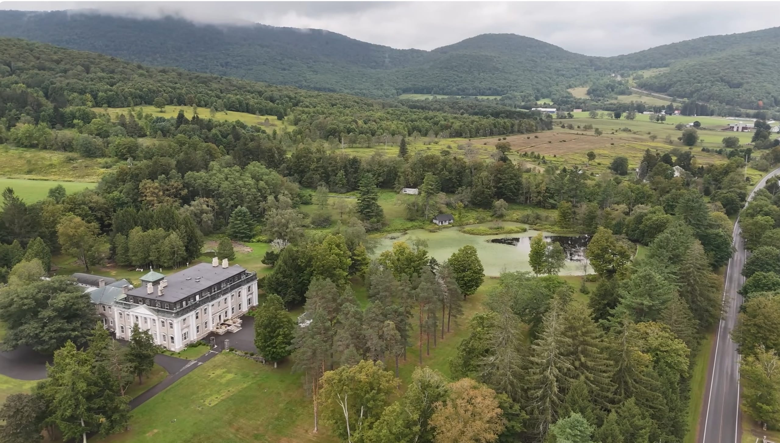 Ashridge estate — aerial view of the mansion, Italian garden, conservatory, lake, and 1,118 private acres, South Kortright, New York
