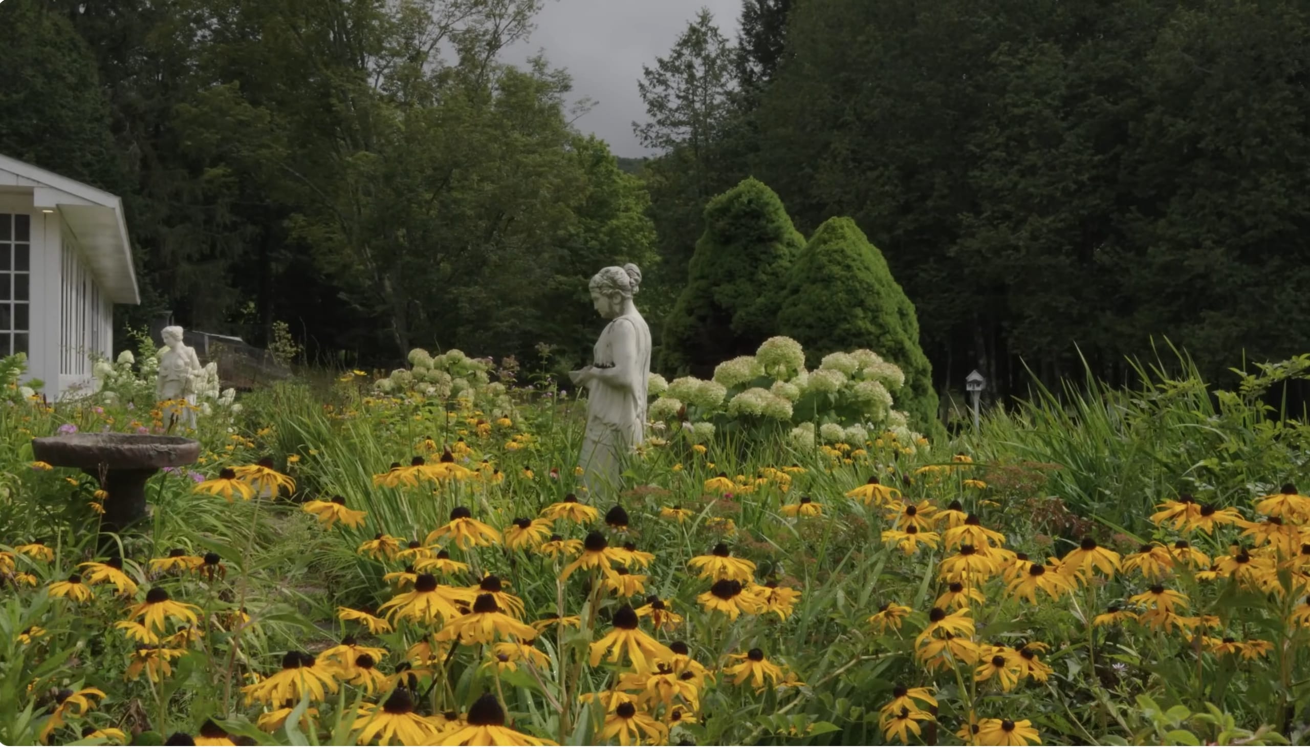 Ashridge formal garden — flower beds and stone paths below the mansion terrace, South Kortright, New York