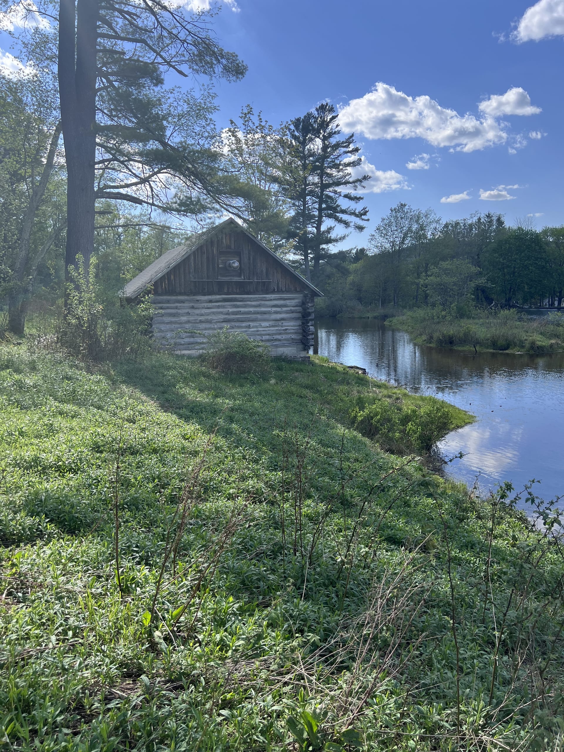 Ashridge estate log boathouse at the edge of the private lake, South Kortright, New York