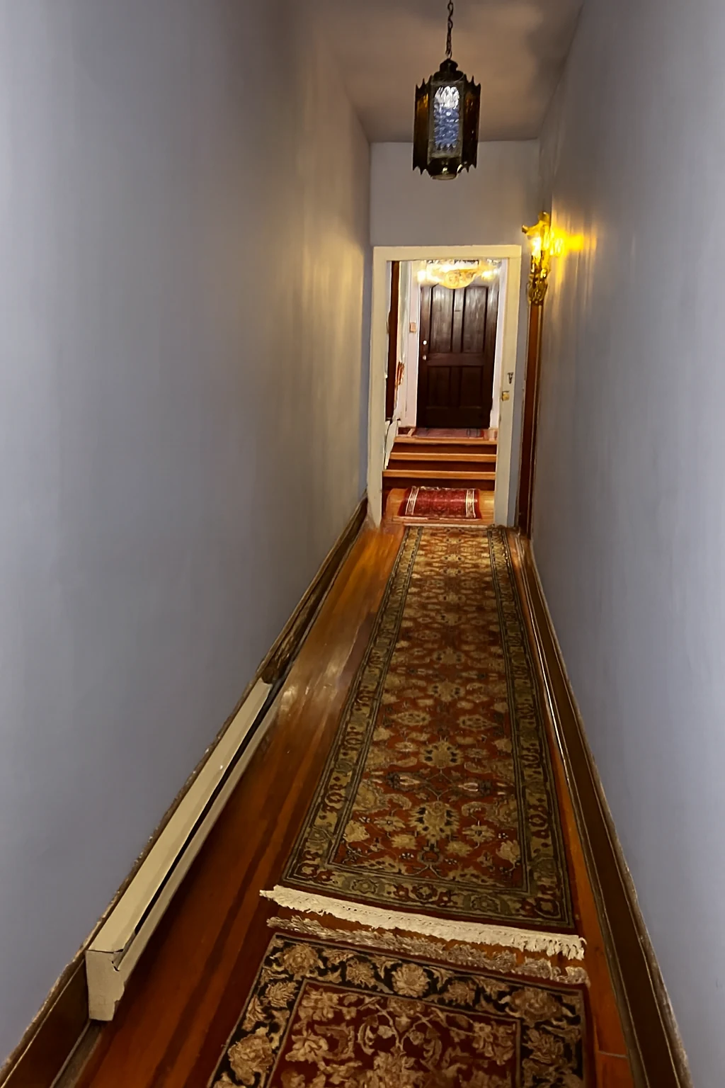 Ashridge mansion hallway — cleared enfilade view with pilasters and aligned doorways