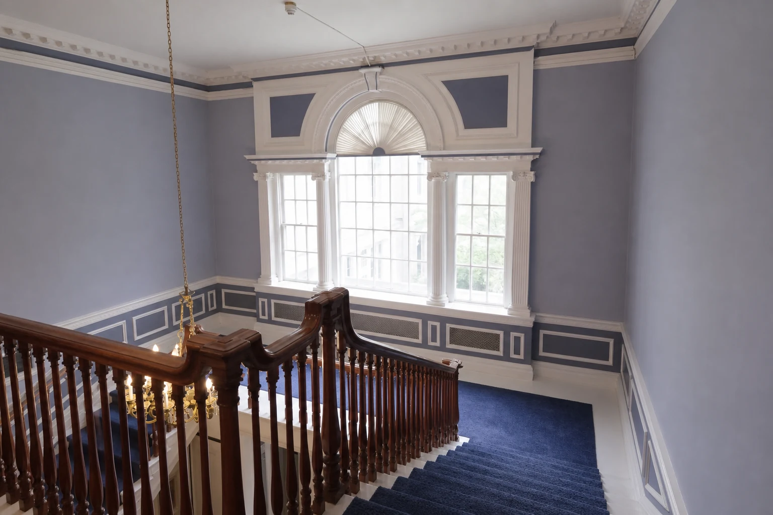 Ashridge mansion main stair hall — cleared window wall with balustrade and natural light