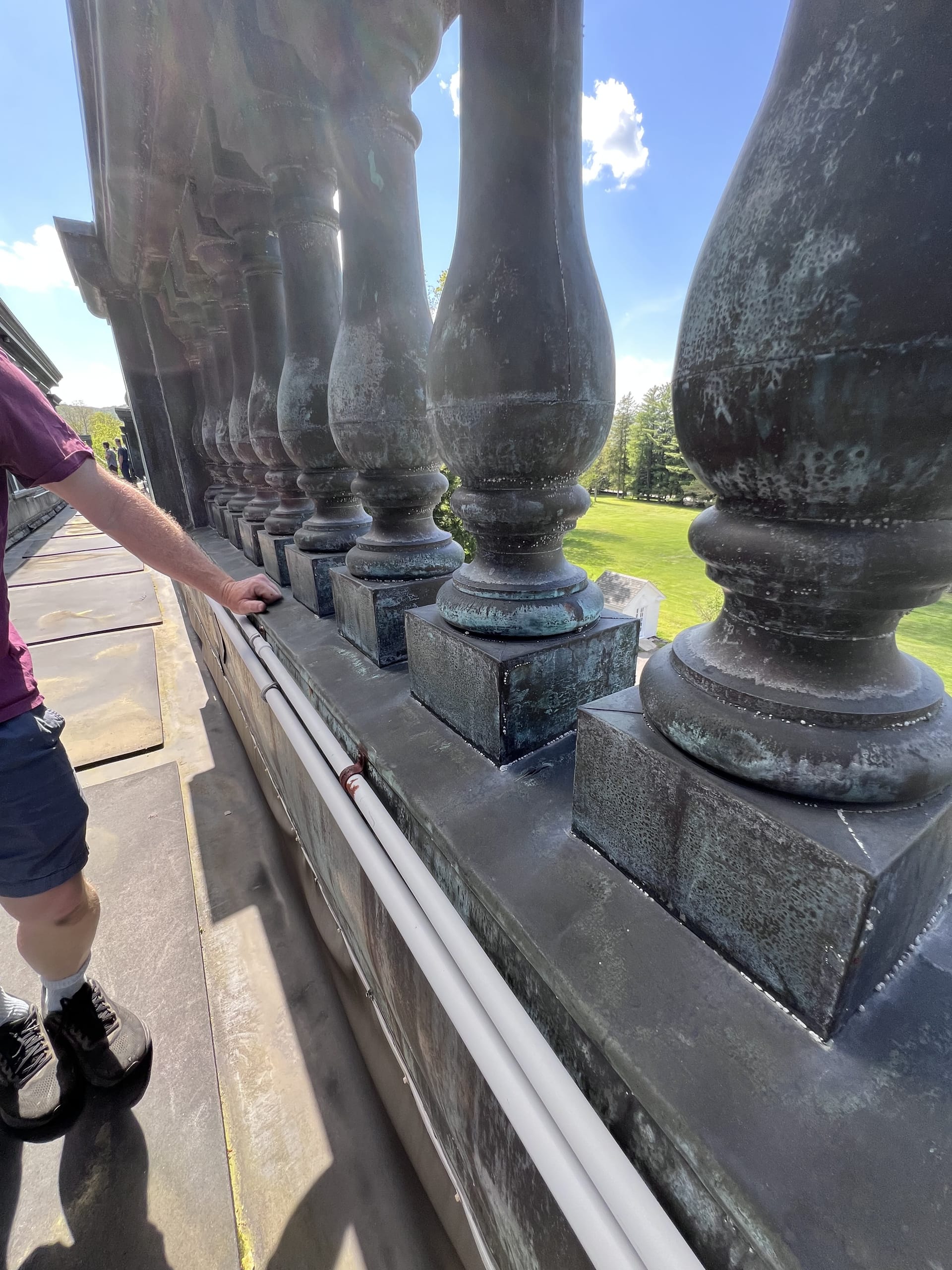 Ashridge mansion roof walkway — verdigris balustrade detail overlooking the formal lawn, South Kortright, New York