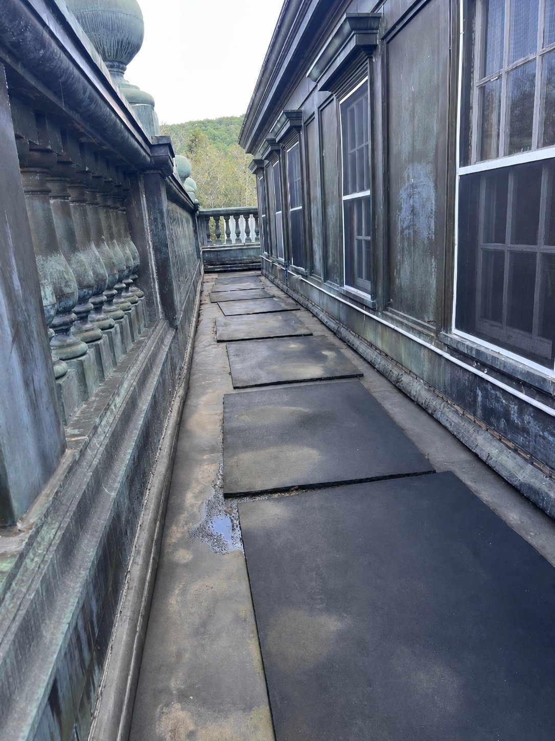 Ashridge mansion roof walkway — verdigris balustrade and perimeter path along the original copper roof, South Kortright, New York